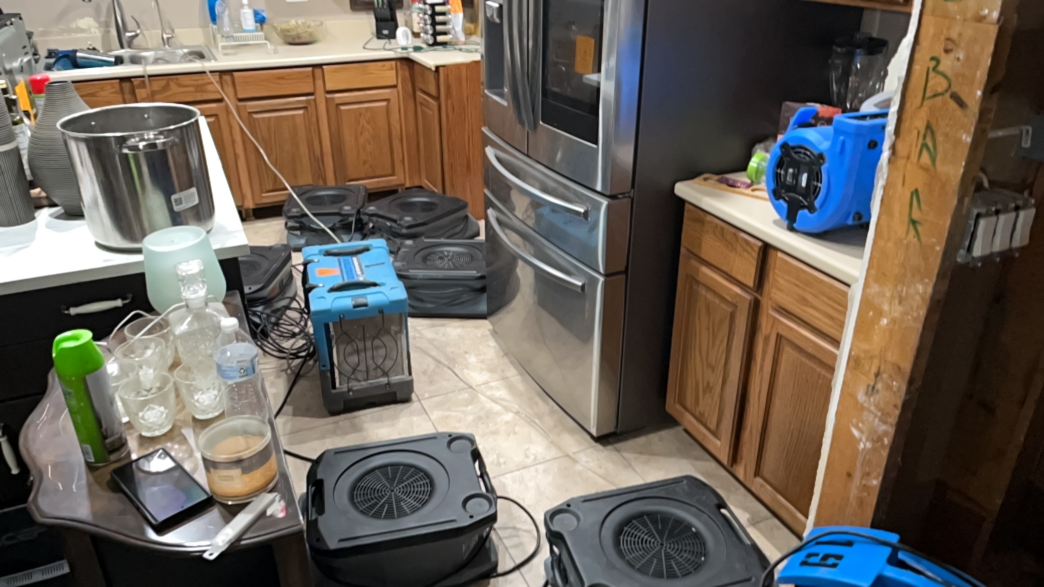 Wesmor drying equipment in a residential kitchen after water damage